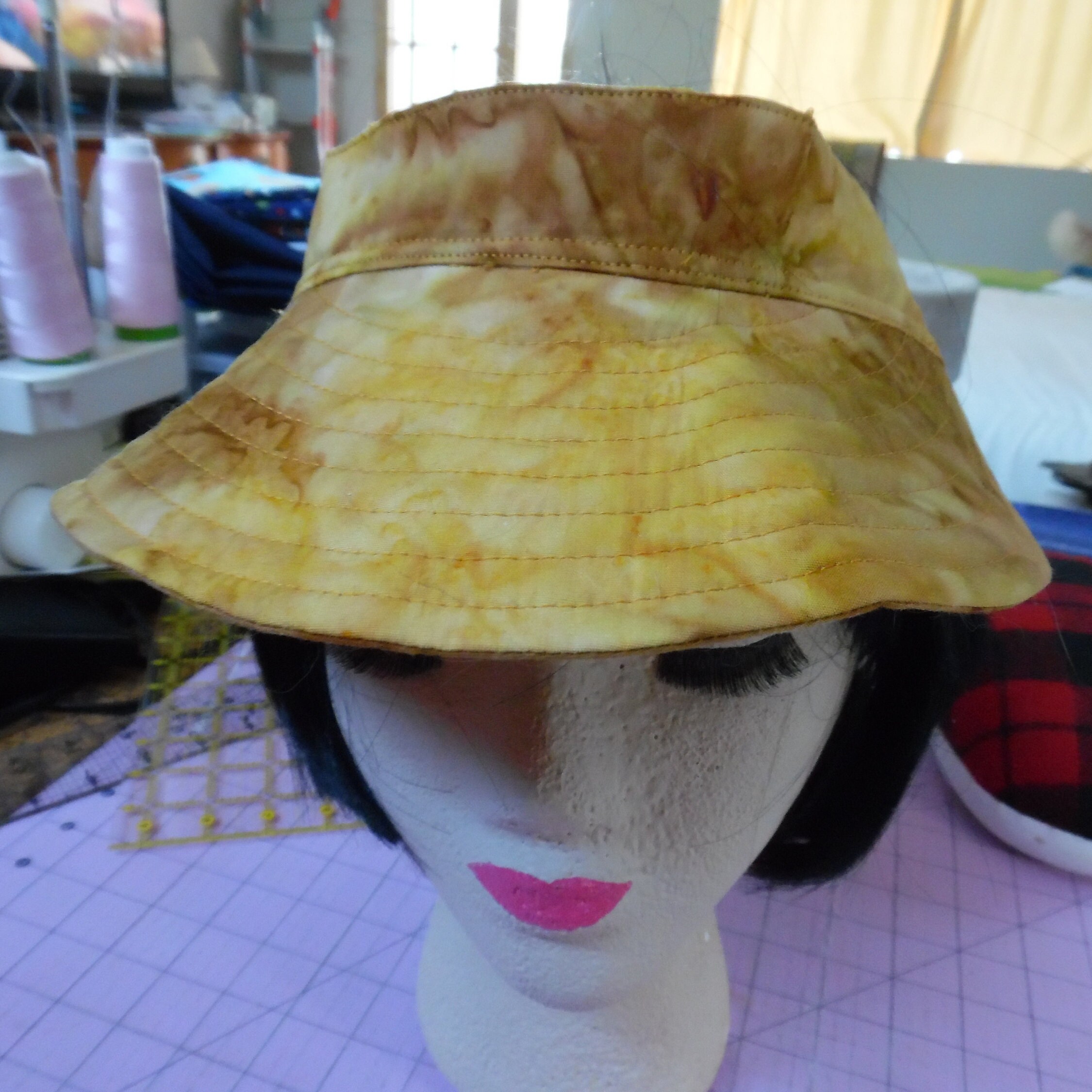 gold visor hat