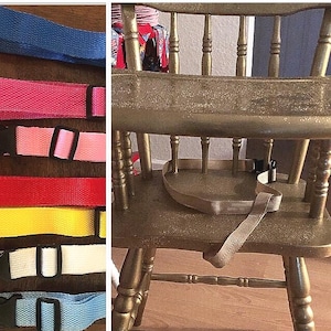 May include: A gold-painted wooden high chair with a beige safety strap. To the left, a selection of colorful nylon straps with black buckles in blue, pink, light pink, red, yellow, white, and light blue.