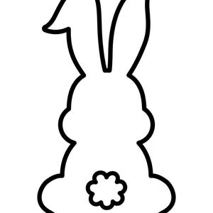 May include: A black and white line drawing of a rabbit sitting with its ears up. The rabbit has a fluffy tail.