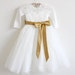 danaemullings reviewed Long Sleeves Light Ivory Flower Girl Dress Lace Tulle Flower Girl Dress With Gold Sash/Bows Floor-length