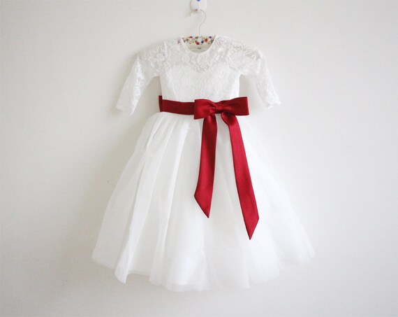 white flower girl dress with burgundy bow