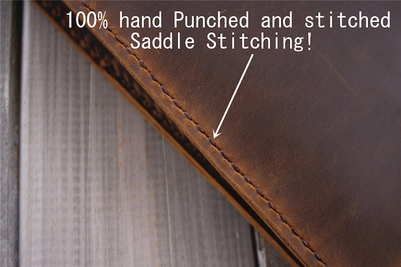May include: Close-up of a brown leather item with visible saddle stitching. The text in the image reads "100% hand Punched and stitched Saddle Stitching!" The leather has a distressed appearance, with variations in color and texture.