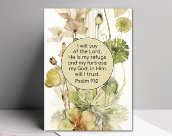 May include: A rectangular greeting card featuring a central circular beige emblem with the text: I will say of the Lord, He is my refuge and my fortress; my God; in Him will I trust. Psalm 91:2. The card displays botanical illustrations of flowers.