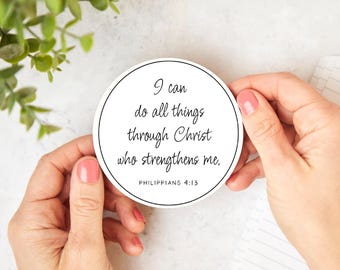 May include: White round sticker with black text that reads "I can do all things through Christ who strengthens me. Philippians 4:13".