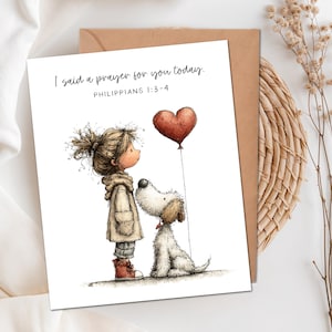 May include: A greeting card featuring a whimsical illustration of a child in a beige coat and red boots standing next to a white dog. The dog looks up at a red heart-shaped balloon. The text reads: I said a prayer for you today. PHILIPPIANS 1:3-4.