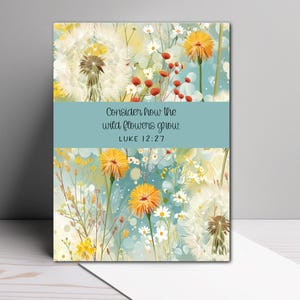 May include: Greeting card featuring a floral design with dandelions, daisies, and other wildflowers in shades of yellow, orange, and white against a light blue background. The text "Consider how the wild flowers grow: Luke 12:27" is displayed.