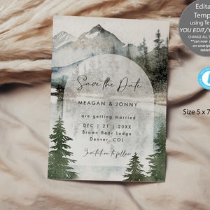Pu&ograve; includere: Un biglietto di salvataggio della data con una scena di montagna ad acquerello e una luna. Il testo recita "Save the Date" con i nomi Meagan & Jonny, la data 21 dicembre 20XX, la posizione Brown Bear Lodge, Denver, CO, e "Invitation to follow". La carta misura 5 x 7 pollici.