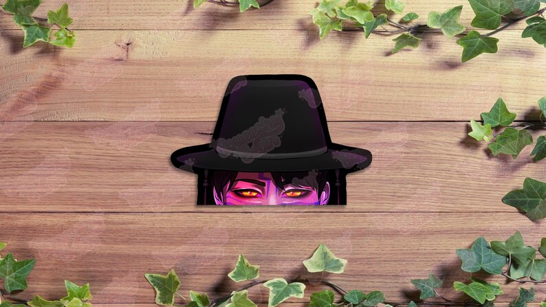 May include: A black fedora hat with a purple and gray design, partially obscuring a pair of glowing orange eyes. The image is set against a wooden background, with green ivy leaves and vines framing the edges.