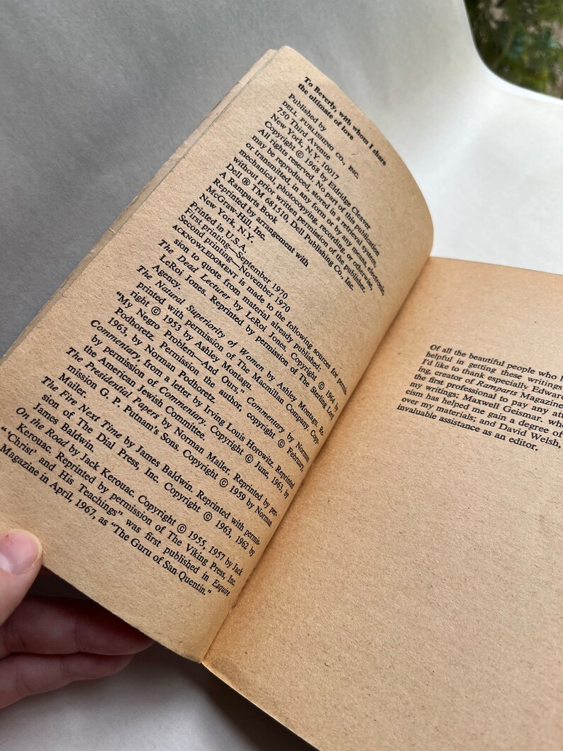 May include: A close-up of a book with a brown cover and white text. The title of the book is "Soul on Ice" by Eldridge Cleaver. The book is about the author's experiences in prison and his views on race and society.