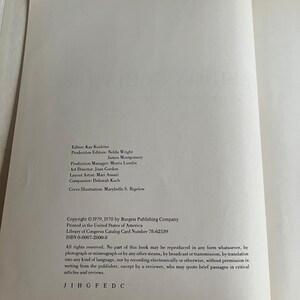 May include: A book with a white cover and black text. The title of the book is not visible. The text on the cover includes the copyright information, the publisher, and the Library of Congress Catalog Card Number. The text also includes the ISBN number and a statement about the copyright.