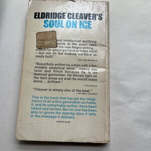 May include: A book cover with a blue and white title "Soul on Ice" by Eldridge Cleaver. The cover features a quote from The New Republic, "Beautifully written by a man with a formidably analytical mind...makes you twist and flinch because he is no damned gentleman. He throws light on the dark areas we wish he would leave alone...brilliant."