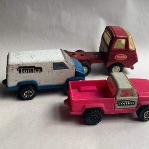 Vintage Tonka Truck Lot, Red Truck, Pink Truck and Blue Van circa 1970s