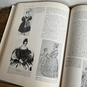 May include: A vintage fashion illustration depicting women wearing dresses from the 1840s. The dresses feature full skirts, high necklines, and puffed sleeves. The illustration is in black and white and has a detailed, intricate style.