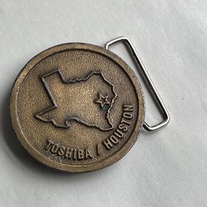 Vintage Toshiba Houston Texas Brass Belt Buckle