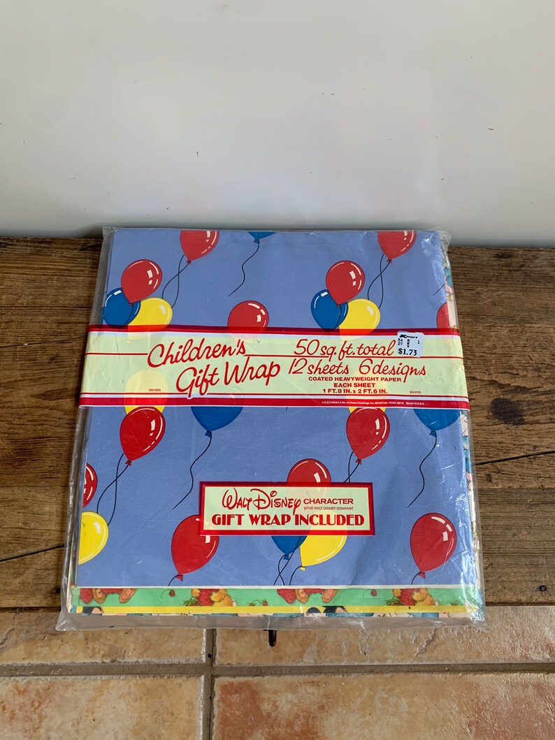 May include: A pack of 12 sheets of Children's Gift Wrap featuring 6 different designs with a total of 50 square feet of wrapping paper. The designs feature balloons and a Walt Disney character. The pack is priced at &pound;1.71.