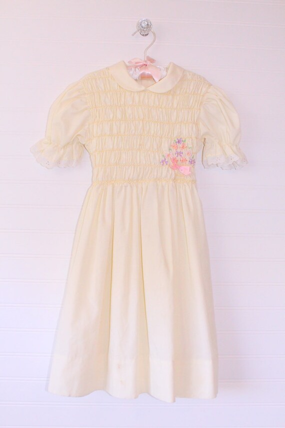 Vintage girls dress. Yellow with smocking, Winnie… - image 1