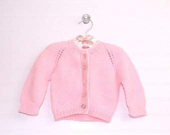 Vintage baby sweater, pink knit with 5 pearly buttons up the front, size about 3-6 months