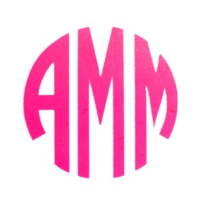 May include: A bright pink monogram design featuring the letters AMM arranged within a circular shape. The letters are bold and blocky, creating a striking visual contrast against the white background. This design is suitable for personalized items.