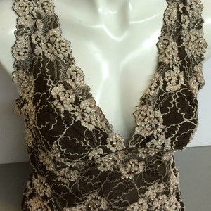 Lace top waist length blouse in beige and brown color combination hand decorated with sequins and beads