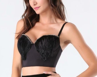 Black crop top bustier bra decorated with black ostrich feathers and gold beads.