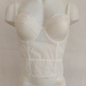 Bustier corset longline waist length top in ivory color with floral embroidery lace.