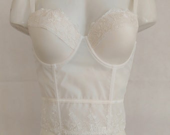 Bustier corset longline waist length top in ivory color with floral embroidery lace.