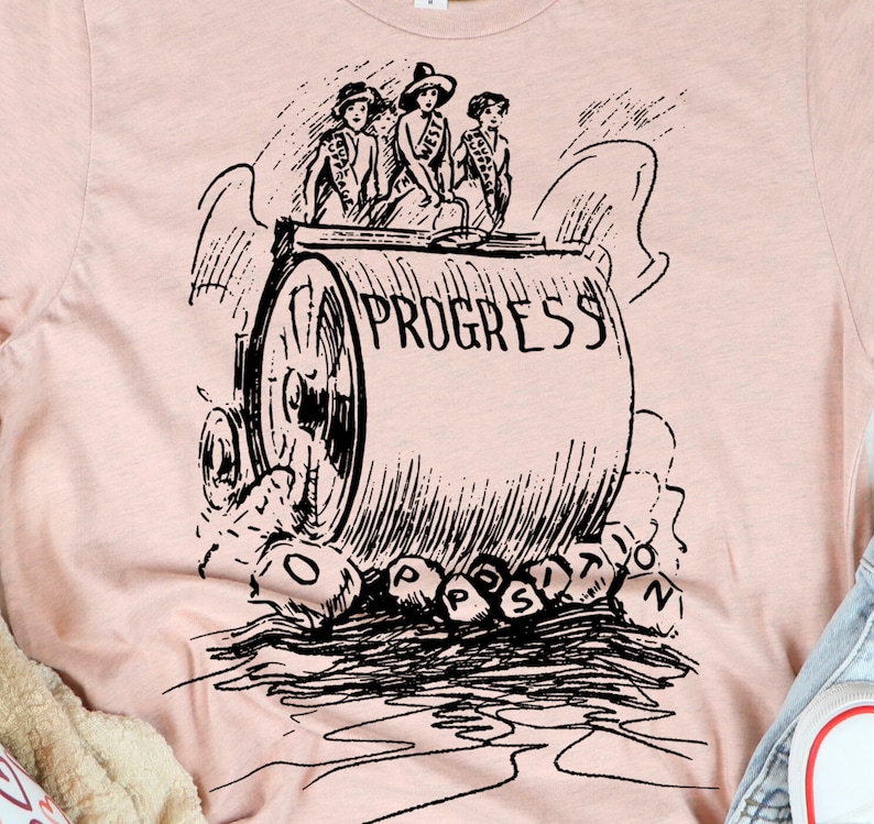 May include: A black and white illustration of three women riding on a steamroller labeled "PROGRESS". The women are wearing hats and dresses. The steamroller is crushing letters that spell out "OPPOSITION".