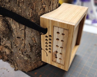 Minimalist solitary bee house made of bamboo - tree satchel-style