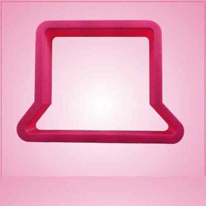 May include: A bright pink, rectangular cookie cutter with a rounded bottom and a square top. The cutter is made of plastic and is set against a soft pink background.