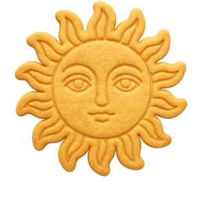 May include: A golden-yellow sun-shaped cookie with a smiling face and radiating rays. The cookie has a detailed design, with visible facial features and textured edges. The image is isolated on a white background, highlighting the cookie's shape and color.