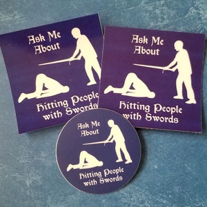 HEMA « Ask Me About Hitting People with Swords » autocollants et aimants