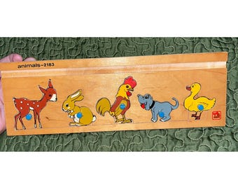 Quebra-cabeça de madeira vintage da Steinmeier Toys com animais da fazenda e pinos.