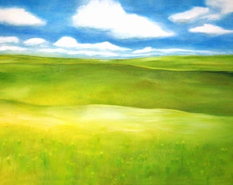 green grass and billowing blue sky