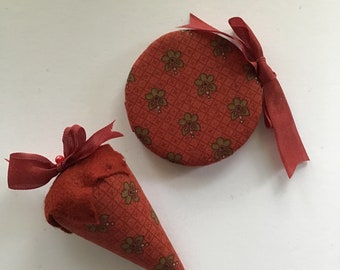 Red floral sewing set with needlecase and matching strawberry emery.