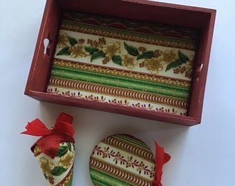 Red and green sewing tray with matching needle case and strawberry emery.