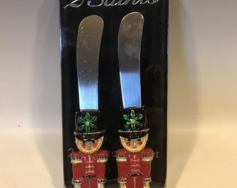 2 saints 2 piece nutcracker spreader set red green gold enameled and jeweled, glam Christmas decor, Christmas table decor
