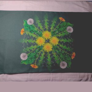 May include: A dark green pillowcase with a white and yellow dandelion flower design. The flowers are arranged in a circular pattern with green leaves.
