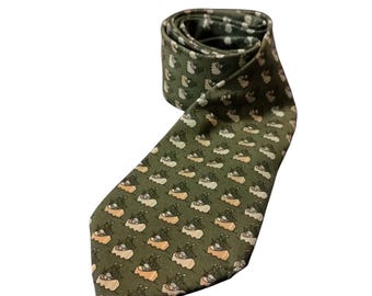 May include: A green silk tie with a repeating pattern of small boats in a light orange and green color scheme.