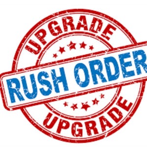 May include: Red and blue distressed rubber stamp with the text "Upgrade" and "Rush Order" in a circle.