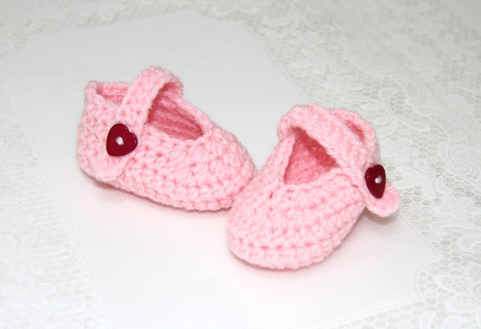 pink baby ballets shoes with heart shaped buttons