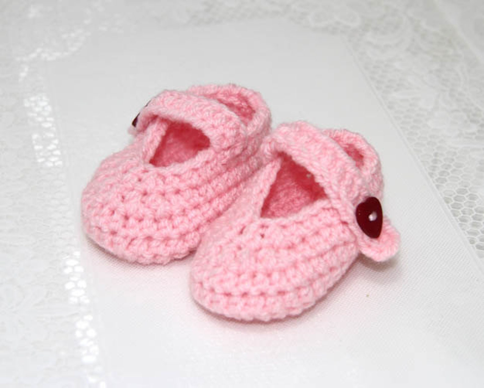 pink baby ballets shoes with heart shaped buttons