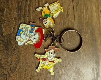 cowboy and alien keychains