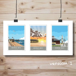 May include: Three framed art prints featuring Herne Bay, Kent Coast. Each print depicts a different scene: a pier with boats, a sunset over the sea, and a clock tower. The prints are displayed on a wooden background and held by black clips.