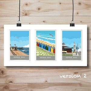 May include: Three framed art prints featuring Herne Bay scenes. The prints depict a pier, colorful beach huts, and a clock tower, all under blue skies with seagulls. The text "Herne Bay" and "Kent Coast" are at the bottom of each print.