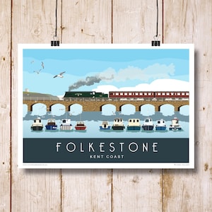 May include: A colourful illustration of a train crossing a bridge over a body of water with boats and seagulls. The text "Folkestone Kent Coast" is at the bottom of the image.