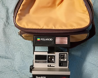 Polaroid Sun 600 Vintage Camera with bag and booklet