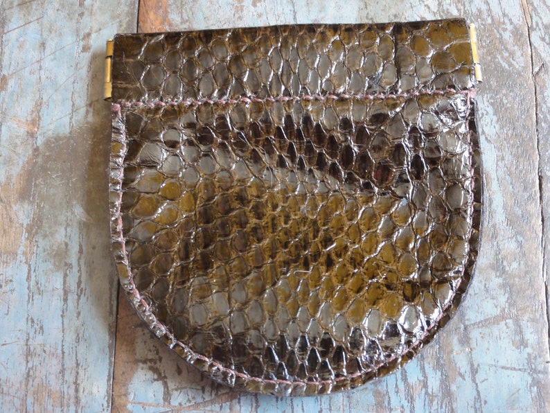 Leather change pouch made with water snake skin brown leather earbud case.
