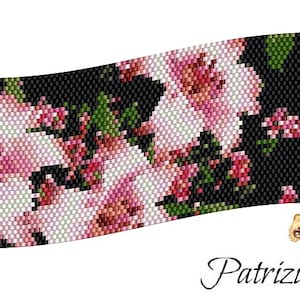May include: A beaded bracelet with a design of pink flowers on a black background. The bracelet is curved and has a slight wave pattern.