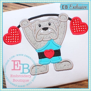 May include: A gray bulldog lifting two red hearts with white polka dots. The bulldog is wearing a blue and black outfit with a red heart on the belt. The text "EB Exclusive" is in the upper right corner of the image.