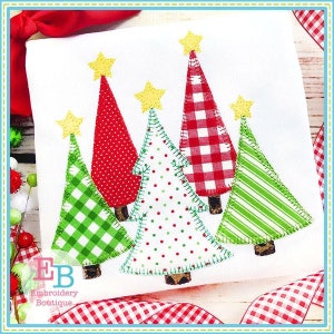 May include: Five Christmas trees in different patterns and colors. The trees are made of fabric and have a stitched outline. The trees are decorated with yellow stars.